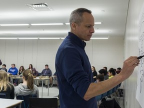 BEA SERDON/SPECIAL TO THE INTELLIGENCER
Kirk Brant illustrates the Iroquois creation story while Joe Brant talks about it to high school students from the Hastings and Prince Edward District School Board during their annual student symposium held at Loyalist College in Belleville on Monday. Students from different schools gathered to listen to speakers discuss all about indigenous culture, from current issues to their history.