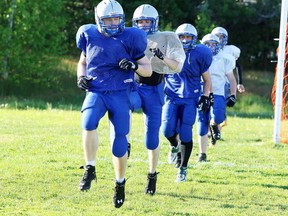 Graeme Stevens leads the Sudbury Gladiators through drills last season. Stevens is one of three local football players committed to Canadian university football next year who have decided to return to the Gladiators for summer football. Gino Donato/The Sudbury Star