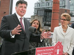 Ontario's Finance Minister Charles Sousa along with Premier Kathleen Wynne announce the Liberals Fair Housing Plan in Liberty Village on April 20, 2017 in Toronto. Veronica Henri/Toronto Sun/Postmedia Network