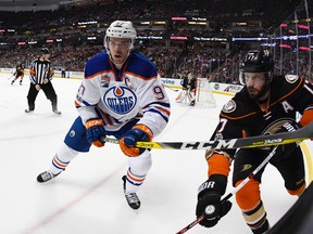 Edmonton Oilers center Connor McDavid, left, and Anaheim Ducks center Ryan Kesler chase the puck on Jan. 25, 2017, in Anaheim, Calif. (AP Photo)