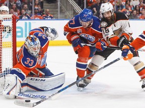 Anaheim Ducks' Patrick Eaves (18) vies for the puck with Edmonton Oilers' Oscar Klefbom (77) as goalie Cam Talbot (33) makes the save during first period NHL action in Edmonton, Alta., on Saturday, April 1, 2017. (The Canadian Press)