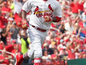 St. Louis Cardinals' Dexter Fowler watches his solo home run during the fifth inning of a baseball game against the Pittsburgh Pirates on April 19, 2017, in St. Louis. The home run was Fowler's second of the game. (JEFF ROBERSON/AP)