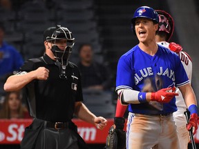 Chris Coghlan #7 of the Toronto Blue Jays reacts after called out on a checked swing by umpire Toby Basner #99 in the ninth inning of the game against the Los Angeles Angels at Angel Stadium of Anaheim on April 24, 2017 in Anaheim, California. Angels won 2-1. (Photo by Jayne Kamin-Oncea/Getty Images)