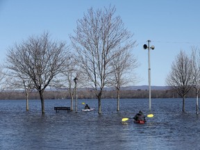 Two men kayak in Britannia Bay Park in Ottawa Monday April 24, 2017. High water still has the park flooded.