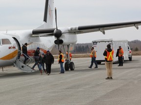 Members of the Town of Cochrane greet Kashachewan evacuees when they flew into Cochrane last week. It was the first time in a number of years that Cochrane has been a host community for the residents of the flooded Northern community. The residents will be staying in Cochrane for an estimated two weeks until it is safe for them to return to their home.