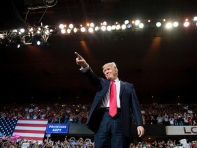 US President Donald Trump arrives for a 'Make America Great Again' rally at the Kentucky Exposition Center in Louisville, Kentucky, March 20, 2017. AFP