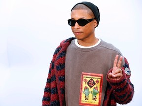 Pharrell Williams poses during the photocall before the Chanel women's Fall-Winter ready-to-wear collection fashion show in Paris on March 7, 2017. / AFP PHOTO / FRANCOIS GUILLOT (Photo credit should read FRANCOIS GUILLOT/AFP/Getty Images)