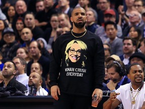 Drake looks on from his courtside seat during the second half of an NBA game between the Golden State Warriors and the Toronto Raptors at Air Canada Centre on November 16, 2016 in Toronto. (Vaughn Ridley/Getty Images)