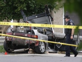 Ottawa police investigate a fatal crash as a possible street-racing incident in this 2010 file photo.