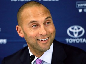 In this Sept. 28, 2014, file photo, New York Yankees' Derek Jeter speaks to the media after the last baseball game of his career, against the Boston Red Sox, at Fenway Park in Boston. (AP Photo/Steven Senne, File)