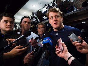 Maple Leafs defenceman Morgan Rielly chats with reporters during locker room clean-out day at the ACC. Rielly said he would be open to playing for Team Canada in the world championship, if invited. (THE CANADIAN PRESS/PHOTO)
