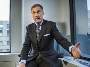 Conservative leadership candidate Maxime Bernier talks with reporters at the Toronto Sun offices on Tuesday, April 25, 2017. (ERNEST DOROSZUK/TORONTO SUN)