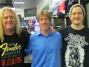 From left, Doug Stewart and Chris Joyce with the band CD-DC, joined by drummer Mason Stewart, performed during a Kids Help Phone event Tuesday April 25, 2017 at St. Patrick's Catholic High School in Sarnia to promote this years's Walk so Kids Can Talk fundraising walk for the national help line. This year's walk is happening May 7 at Canatara Park. The concert by CD-DC has been an eight-year tradition at the high school. ( Paul Morden/Sarnia Observer)