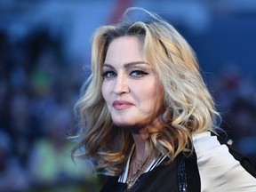 Madonna poses arriving on the carpet to attend a special screening of the film "The Beatles Eight Days A Week: The Touring Years" in London on Sept. 15, 2016. (BEN STANSALL/AFP/Getty Images)