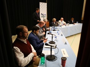 Candidates in the Countryside District byelection take their seats for a debate in Kingston Mills on Tuesday night. (Elliot Ferguson/The Whig-Standard)