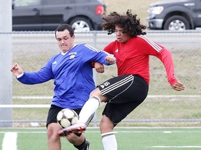 St. Charles Cardinals' Greg Trudeau Paquette gets to a ball just ahead of a St. Benedict Bears player during senior boys high school soccer action at James Jerome Sports Complex on Tuesday afternoon. The teams played to a 1-1 draw.