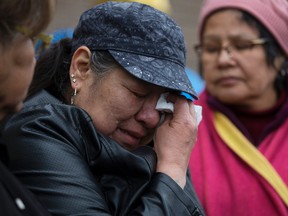 19-month-old Anthony Raine's paternal grandmother Connie Crier cries as she thanks supporters at the memorial for Anthony outside the Good Shepherd Anglican Church, 15495 Castle Downs Road, in Edmonton Tuesday April 25, 2017. Raine's body was found outside the church April 21, 2017.