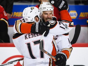 Anaheim Ducks' Ryan Getzlaf, right, celebrates his empty net goal with teammate Ryan Kesler during third period NHL hockey round one playoff action against the Calgary Flames, in Calgary, Wednesday, April 19, 2017.