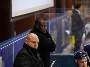 NAIT Ooks men’s hockey, Tim Fragle, left, directs his team from the bench alongside assistant coach Shawn Belle.