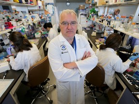 Dr. John Bell poses for a photo in his lab at the Ottawa Hospital Research Institute.