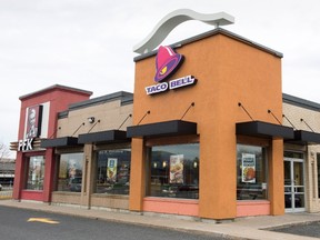 A Taco Bell restaurant is seen Tuesday, April 25, 2017 in Brossard, Que. Taco Bell customers will be able to grab beer with their tacos and burritos at some Canadian stores starting this June. THE CANADIAN PRESS/Paul Chiasson