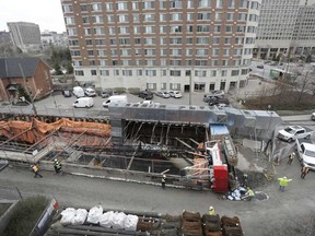 A crane flipped at the construction site of the east entrance of the LRT near Waller and Laurier after failing to lift a truck, in Ottawa on April 26, 2017.