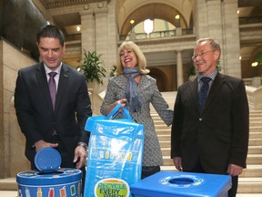 Recycling options are expanding in Manitoba. Pictured are Minister of Sustainable Development Cathy Cox, CBCRA executive director Ken Friesen (right) and executive director of Building Owners and Managers Association of Manitoba Tom Thiessen. Tuesday, April 25, 2017. 
Chris Procaylo/Winnipeg Sun