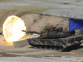 A South Korean army's K1A2 tank fires during South Korea-U.S. joint military live-fire drills at Seungjin Fire Training Field in Pocheon, South Korea, near the border with North Korea, Wednesday. April 26, 2017. (AP Photo/Ahn Young-joon)