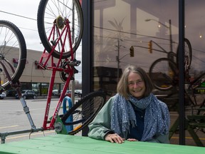 BEA SERDON/SPECIAL TO THE INTELLIGENCER
Frances Key poses with one of Michael Amar's art installations which is part of A_WALL, an outdoor art exhibit that hopes to further the revitalization of downtown Belleville. Amar's bike and picnic table sculpture is located at The Brake Room. Other pieces of the art show are located throughout the downtown area.