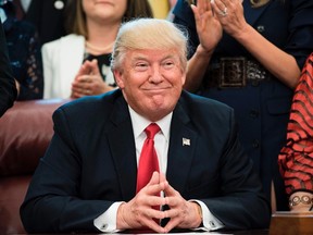 US President Donald Trump smiles during a national teacher of the year event in the Oval Office of the White House April 26, 2017 in Washington, DC. (BRENDAN SMIALOWSKI/AFP/Getty Images)