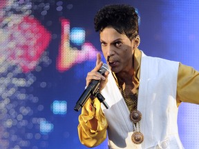 US singer and musician Prince (born Prince Rogers Nelson) performs on stage at the Stade de France in Saint-Denis, outside Paris, on June 30, 2011.(BERTRAND GUAY/AFP/Getty Images)
