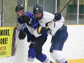 Sudbury Wolves 1 st round draft pick Blake Murray battles for the puck with Bryce Lewis during the blue, white scrimmage at the Sudbury Wolves orientation camp in Sudbury, Ont. on Sunday April 23, 2017. Gino Donato/Sudbury Star/Postmedia Network