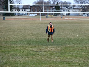 Rodger Davidson, acting director of park operations, looks over the filed after holding a news conference about the delay in opening city sports fields like this one at Forest Heights Park in Edmonton, Wednesday, April 26, 2017. Ed Kaiser/Postmedia