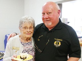JOHN TAPLEY/Postmedia Network
June Cook, a Tillsoburg Lioness for more than 30 years, and Rick Leuszler, a member of the Tillsonburg Lions club for 18 months, shared some anniversary cake during an open house social in the Lions Den at the Tillsonburg Community Centre on Saturday, April 22, marking the Tillsonburg Lions Club's 93rd anniversary, as well as the 100th anniversary of Lions International and the 150th anniversary of Canadian Confederation.