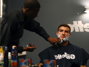 USC quarterback Mitchell Trubisky gets ready for one of the biggest nights of his life at the NFL Draft with a Gillette Fusion ProShield shave at the P&G VIP Style Lounge in Philadelphia with his family on April 26, 2017. (Al Tielemans/AP Images for Gillette)