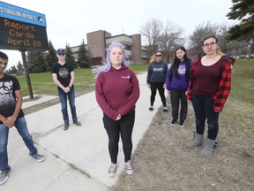 A group of students at Sturgeon Heights are upset that they will lose a music teacher to funding cuts. From left is Jordan, Reilly, Anna Woodman, Alyce, Ashleigh, and Marina. (Winnipeg Sun/Postmedia Network)