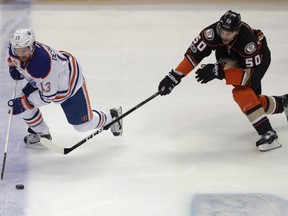 Edmonton Oilers center David Desharnais, left, vies for the puck against Anaheim Ducks center Antoine Vermette during Game 1 of their second-round playoff series in Anaheim, Calif., on Wednesday, April 26, 2017. (Chris Carlson/AP Photo)