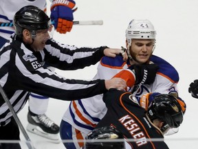 Edmonton Oilers right wing Zack Kassian, top, and Anaheim Ducks center Ryan Kesler fight during the third period in Game 1 of a second-round NHL hockey Stanley Cup playoff series in Anaheim, Calif., Wednesday, April 26, 2017. The Oilers won 5-3.