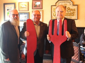 Richard Rainville, left, executive director of Reseau ACCESS Network, Greater Sudbury Mayor Brian Bigger and Kevin McCormick, president and vice-chancellor of Huntington University, and president of the Reseau ACCESS Network board of directors, all share a meal at Fionn MacCool’s on Regent Street in support of the annual A Taste For Life fundraiser on Wednesday. Supplied photo