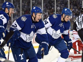 Toronto Maple Leafs winger Connor Brown (12) celebrates his goal with teammates Zach Hyman (11) and Auston Matthews during third period NHL Centennial Classic hockey action against the Detroit Red Wings, in Toronto on Sunday, January 1, 2017. (THE CANADIAN PRESS/Frank Gunn)
