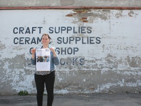 Tara Kretschmer, archival/records and clerk’s assistant with the Municipality of Dutton Dunwich, holds up a poster promoting the mural project. The municipality is asking residents of Elgin County to submit art of any kind to be used in a mural that celebrates Ontario 150.
Laura Broadley/Times-Journal