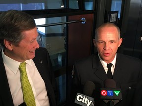 Mayor John Tory and Toronto firefighter Rob Wonfor (CHRIS DOUCETTE)