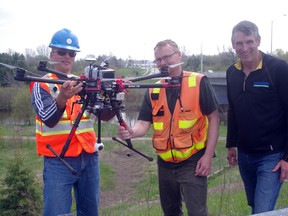 The UTRCA used a drone on the Ingersoll Channel Thursday to gather information for a geomorphology study of the flood control channel. From left Jeff Hirovonen, Dan Helc and Steve Sauder. (HEATHER RIVERS/WOODSTOCK SENTINEL-REVIEW)