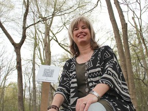 Bright's Grove artist Mary Abma is pictured here along what she's calling the Ash Tree Memorial Trail in Canatara Park. Abma will holding a memorial service and trail tour Saturday as part of a four-year-long art project to commemorate Canatara's fallen ash trees. (Barbara Simpson/Sarnia Observer/Postmedia Network)