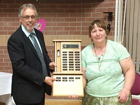 Judith Hennessey receives her Ongwanada Volunteer of the Year award from Wade Durling, chief executive officer of Ongwanada, at the organization’s annual volunteer awards night on Wednesday. (Submitted Photo)