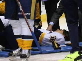 Kevin Fiala of the Nashville Predators lies on the ice after being injured against the St. Louis Blues in Game 1 at the Scottrade Center on April 26, 2017. (Dilip Vishwanat/Getty Images)