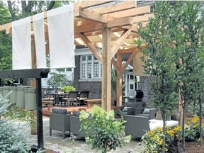 Pergolas with large fabric panels that can be installed every spring are a great way to reduce the amount of sunlight and heat that patio stones absorb.
