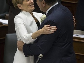 Premier Wynne and Charles Sousa reading of the budget at Queen's Park on Thursday April 27, 2017. (Craig Robertson/Toronto Sun)