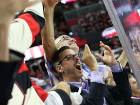 Fans of the Ottawa Senators celebrate their team's first goal against the New York Rangers. JEAN LEVAC / POSTMEDIA NEWS