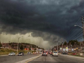 This photo, submitted by Michel Lavallee, shows a dark, menacing cloud over The Kingsway and Barrydowne Road area. Rain appears to fall in the background.